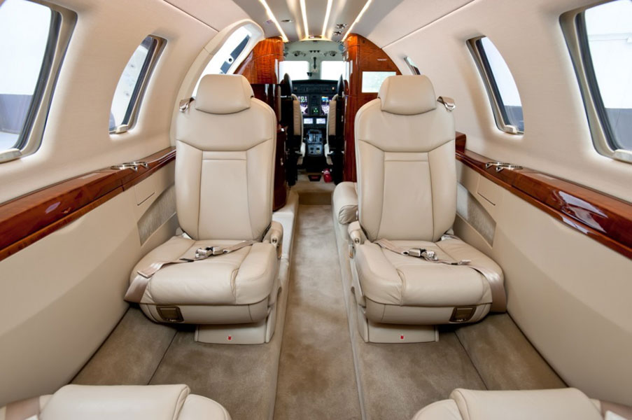 cessna citation interior, cessna citation x, beige leather aircraft interior