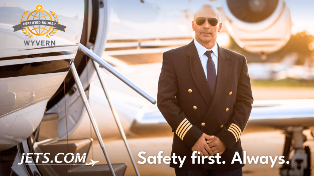 Jets.com private jet broker - pilot standing in front of a private jet with a certified broker - wyvern logo. Text reads "Safety first. Always"